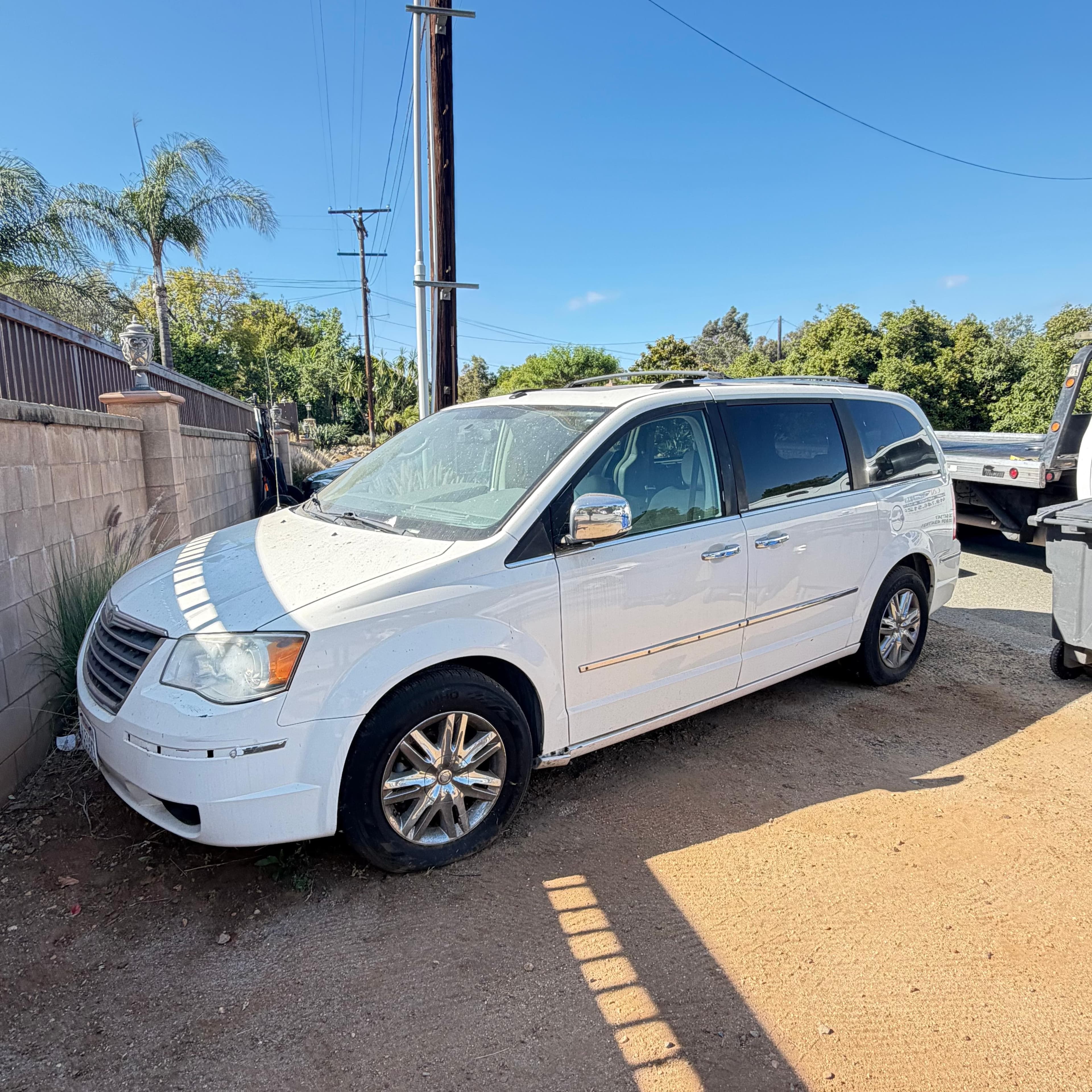 White Chrysler Town and Country minivan